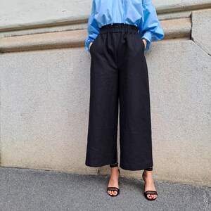 Flared LINEN trousers with pockets and elastic waist/Flared LINEN trousers with pockets and elastic waist image 3