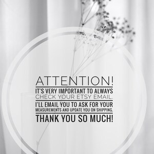 May include: Black and white image with text that reads "ATTENTION!" and other important information. A clear glass vase holds delicate, dried flowers. The background is a soft, blurred curtain.