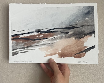 May include: Abstract watercolor painting in shades of brown, gray, and white. The painting depicts a landscape with a horizon line and a cloudy sky. The artist's signature "Indigo, catch, Hayward" and the date "01/24" are visible in the bottom right corner.