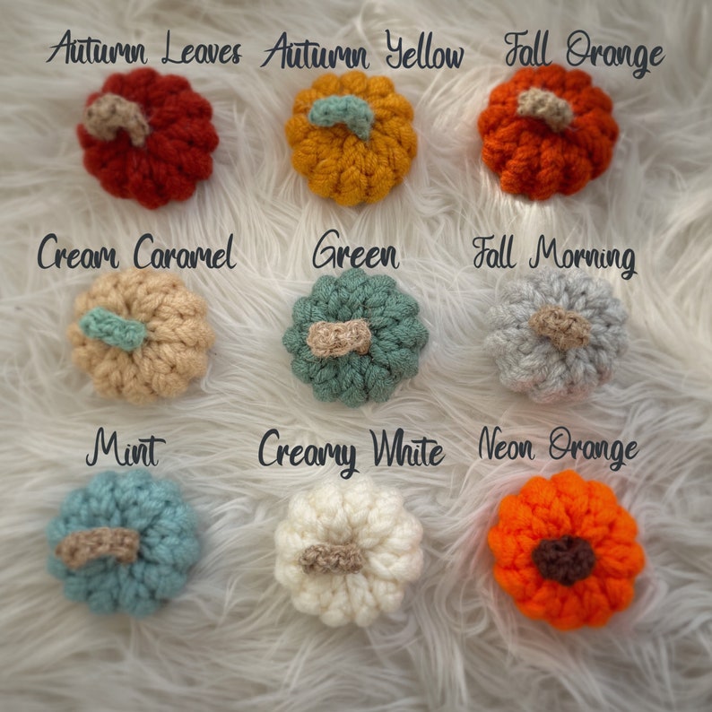 May include: Nine crocheted pumpkins in various colours, including autumn leaves, autumn yellow, fall orange, cream caramel, green, fall morning, mint, creamy white, and neon orange.