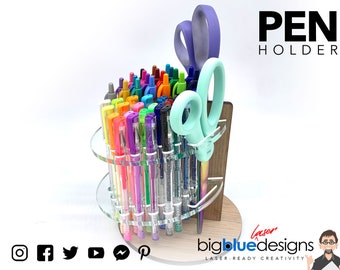 May include: A rotating acrylic pen holder with a wooden base, holding a variety of colourful pens and a pair of scissors. The holder has two tiers and is designed to hold up to 48 pens. The text "PEN HOLDER" is displayed in black letters above the holder. The text "bigbluedesigns LASER-READY CREATIVITY" is displayed below the holder.