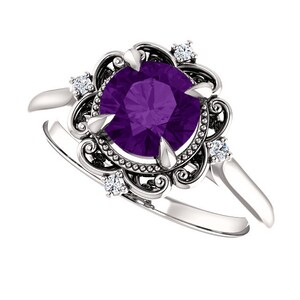 May include: A silver ring featuring a large, round, purple amethyst gemstone set within a delicate, ornate filigree design.  Four smaller, round, white diamonds embellish the filigree.