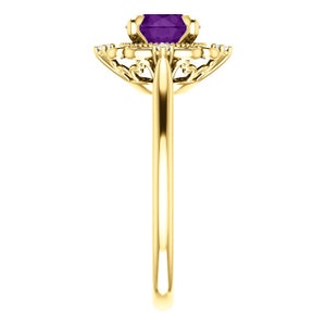 May include: A gold ring featuring a purple gemstone encircled by smaller diamonds. The ring has a delicate, intricate design.