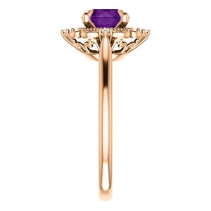 May include: A rose gold ring featuring a purple amethyst gemstone set in a delicate filigree design.