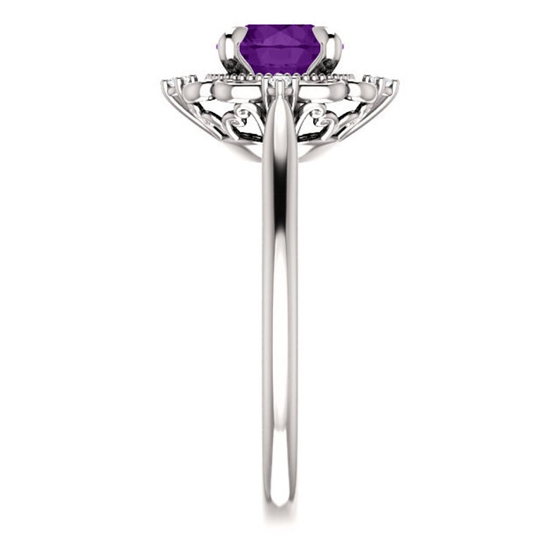 May include: A silver ring featuring a large, purple amethyst gemstone encircled by smaller diamonds. The ring boasts a delicate, ornate design.