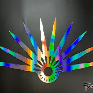 May include: A holographic iridescent fan with a circular design in the centre. The fan has a rainbow colour scheme with blue, green, red, and purple hues.