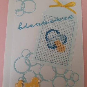 Carte de naissance avec de la broderie