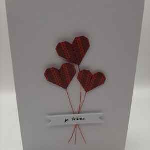 Biglietto origami “mazzo di cuori”.