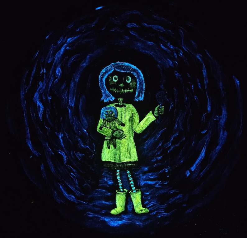 May include: A glowing green illustration of a girl with blue hair and a skeletal face, holding a doll and a small object. She wears a green dress and boots, with a blue swirling background.