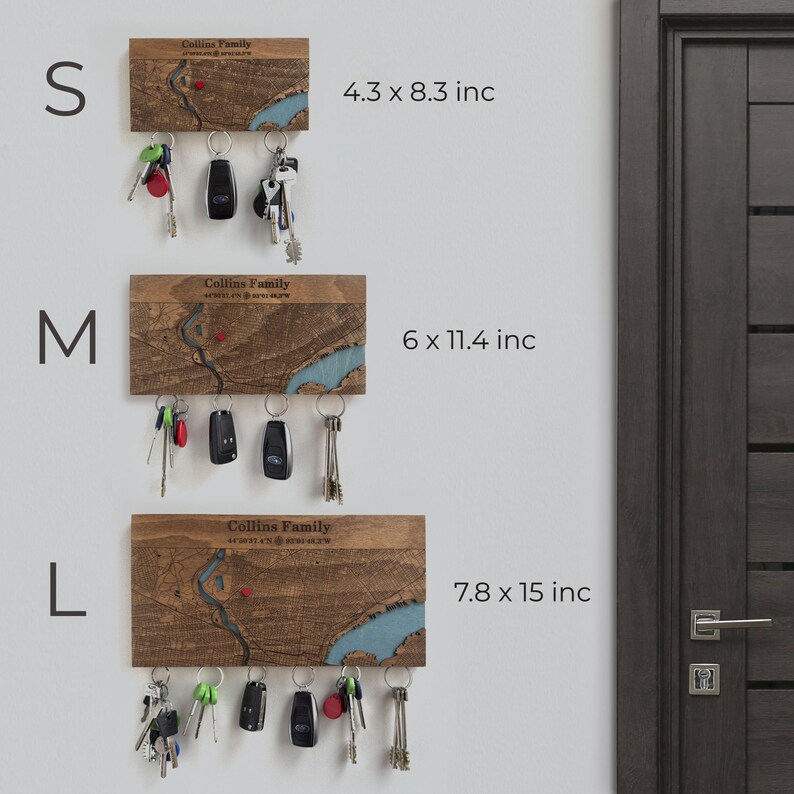 Size chart showing S, M, and L versions of the personalized magnetic key holder mounted on a wall. This image helps buyers choose the right custom map organizer size for their entryway.