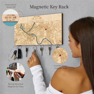 May include: Wooden magnetic key rack with a map design. The rack features a custom home location map and the text "HOME SWEET HOME". Includes a circular design with the text "OUR FIRST HOME Est. June 2025".