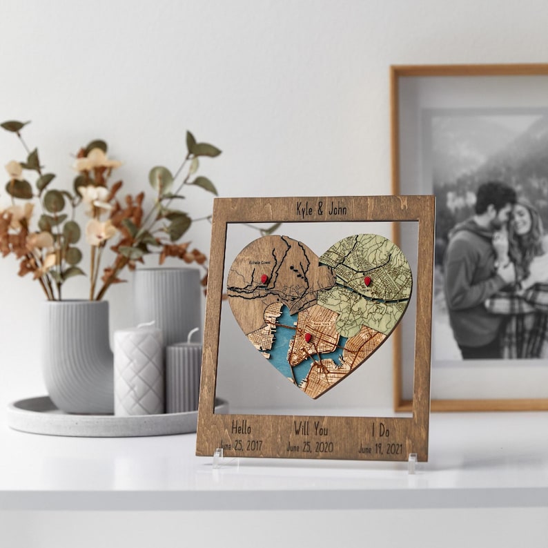 Custom locations framed wood wall art—personalized puzzle map heart with couple names and anniversary dates.