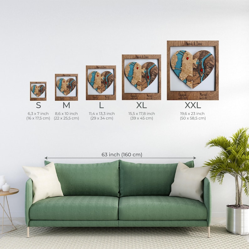 Size chart for the personalized wooden heart map wall art, showing the design in several dimensions from small to extra large above a sofa. This image helps buyers compare scale before choosing the best size for their home or gift occasion.
