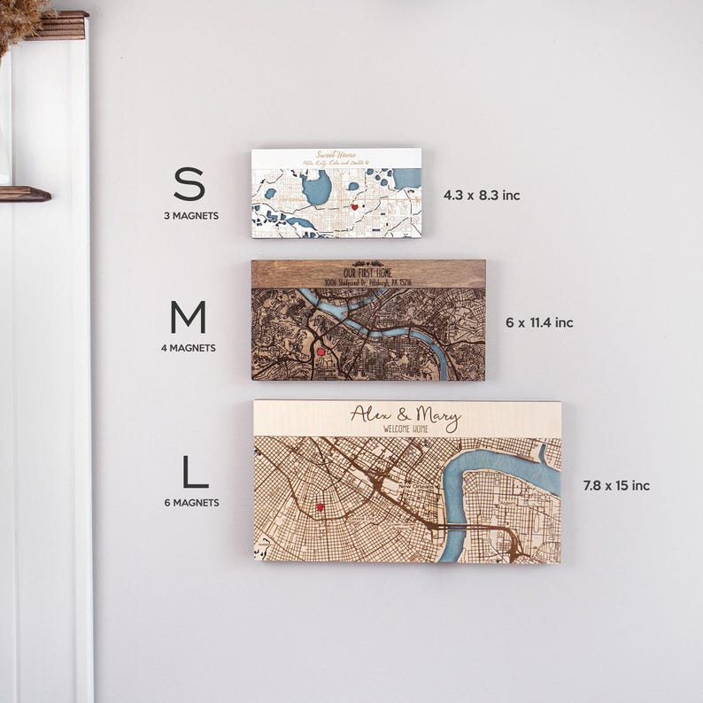 May include: Three sizes of wooden map magnets with a red heart marking a location. The sizes are small (4.3 x 8.3 inches), medium (6 x 11.4 inches), and large (7.8 x 15 inches).
