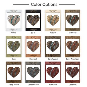 May include: A collage of 12 different wood heart-shaped plaques with a map of a city inside. The plaques are in various wood stains, including white, black, natural, earl grey, sage, gunstock, dark walnut, early american, deep brown, carbon grey, barn red, and cabernet.