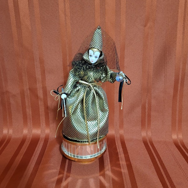 Vintage Gold and Black Porcelain Fortune Teller Doll on a Mirror Music Box. Plays: Greensleeves