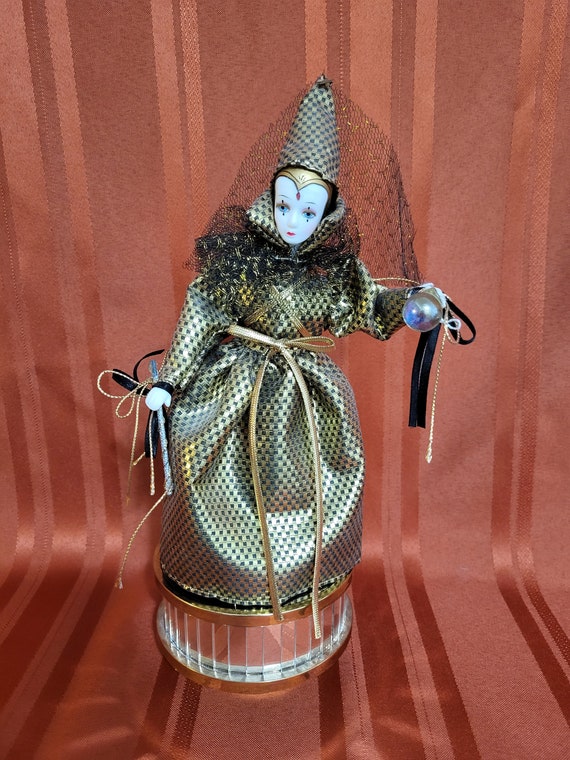 Vintage Gold and Black Porcelain Fortune Teller Doll on a Mirror Music Box.  Plays: Greensleeves 