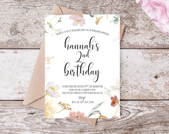 May include: A floral-themed birthday invitation for a girl named Hannah's 2nd birthday party. The invitation features a watercolour design with pink, white, and yellow flowers, green leaves, and gold accents. The text on the invitation reads "Join us to celebrate our wildflower Hannah's 2nd birthday" and includes the date, time, location, and RSVP information.