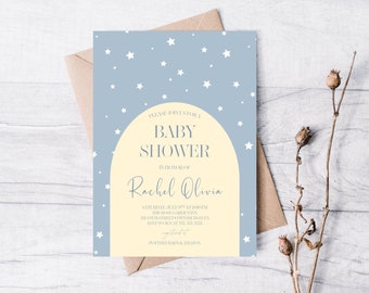 May include: A light blue baby shower invitation with white stars and a yellow crescent moon. The invitation reads "Please join us for a baby shower in honor of Rachel Olivia. Saturday, July 10th at 1:00 PM. The Mongmibuninn. 123 Stumstgielea. RSVP to 333-333-3333. Registered at Pottery Barn & Amazon."