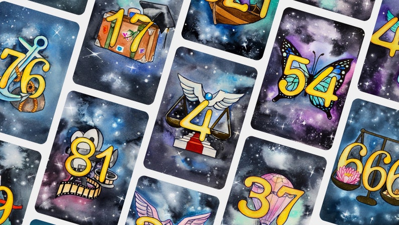 May include: A set of 10 cards with a galaxy background and gold numbers. Each card features a different illustration, including an anchor, a suitcase, a butterfly, a scale, a film reel, a hot air balloon, and a lotus flower.