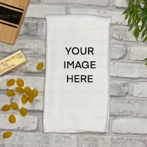 May include: White kitchen towel with the text "YOUR IMAGE HERE" printed in black.