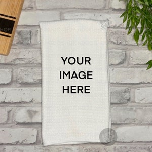 May include: White kitchen towel with the text "YOUR IMAGE HERE" printed in black.