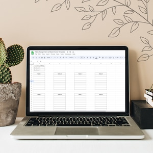 May include: A screenshot of a Google Sheet spreadsheet with the title "Table Assignment & Meal Choice Template". The spreadsheet is divided into columns and rows, with the first column labeled "Seating Table" and the remaining columns labeled "Table 2", "Table 3", "Table 4", "Table 5", "Table 6", "Table 7", and "Table 8".
