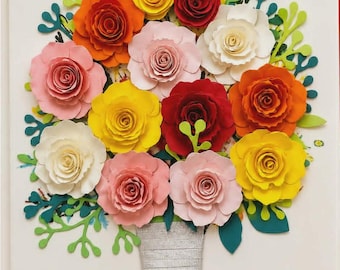 May include: A wall art piece featuring a bouquet of layered paper flowers in shades of red, orange, yellow, pink, and white. The flowers are accented with green paper foliage and stems, and the base is wrapped in silver and green paper strips.