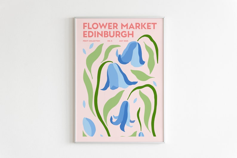 May include: A pink poster with the text "FLOWER MARKET EDINBURGH" in white and pink lettering. The poster features a stylized illustration of blue bell flowers with green leaves on a pink background.