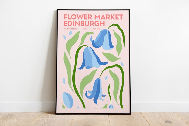 May include: A pink poster with the text "FLOWER MARKET EDINBURGH" in black lettering. The poster features a stylized illustration of blue bell flowers with green leaves on a pink background.