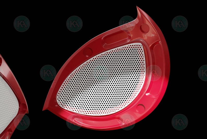May include: Close-up of a red and white spider-man eye mask. The eye is a white mesh with a red frame.