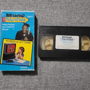 May include: A blue and yellow "Bill Cosby's PicturePages" VHS tape box and a black VHS tape. The box features an image of Bill Cosby and a child, with the text "WORDS & LETTERS". The tape is labeled "WORDS & LETTERS".