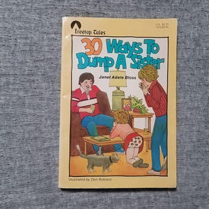 May include: A yellow book cover with the title "30 Ways To Dump A Sister" by Janet Adele Bloss. The cover features illustrations of three children, a cat, and a houseplant.