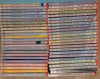 May include: A stack of 40 paperback books with colorful covers. The books are all part of "The Baby-Sitters Club" series by Ann M. Martin. The books are numbered and have titles like "Stacey's Movie", "Kristy at Bat", and "Claudia and the Little Liar".