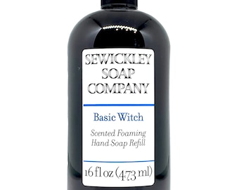 May include: A black bottle of scented foaming hand soap refill. The label reads "SEWICKLEY SOAP COMPANY" and "Basic Witch." The bottle contains 16 fl oz (473 ml) of product.