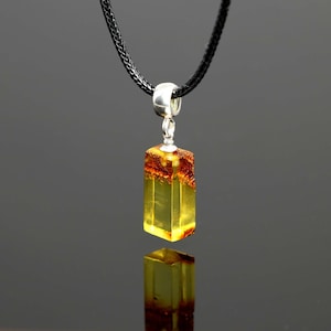 Little amber pendant for men, small gemstone.