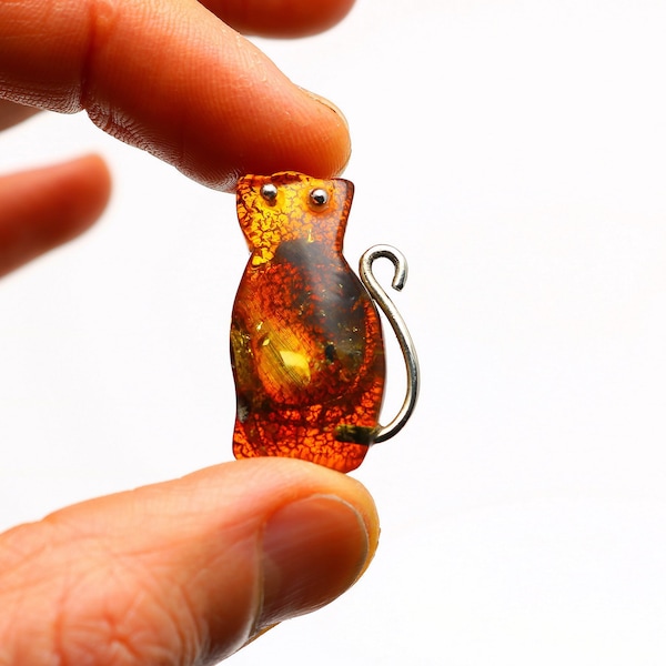 Amber cat brooch. Cherry amber brooch