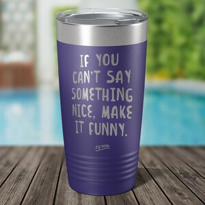 May include: Purple stainless steel tumbler with a white inscription that reads "If you can't say something nice, make it funny."  The inscription is attributed to J.G. Whittier.