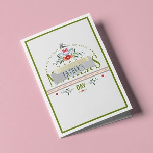 May include: A white Father's Day card with a green border, featuring floral designs and the text "Happy Father's Day." The words "Father" and "Mother" are written above the floral design. The card is taped with a piece of gray tape.