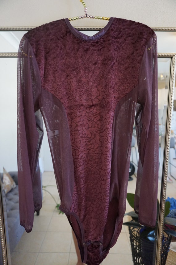 Purple velvet leotard.