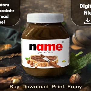 May include: A printable label for a jar of chocolate spread. The label is white with a brown and white illustration of a slice of bread with chocolate spread on it. The label also has the text "name" in red letters and the words "your text here" in black letters.