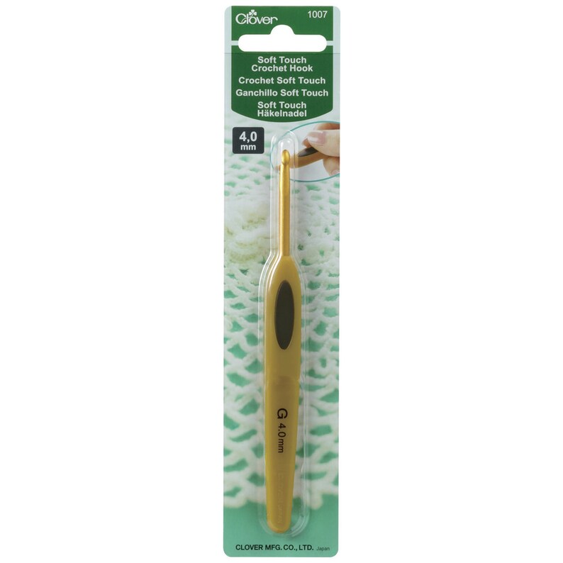 May include: A gold 4.0 mm crochet hook with a black handle. The hook is labelled "Soft Touch Crochet Hook" and "G 4.0mm".