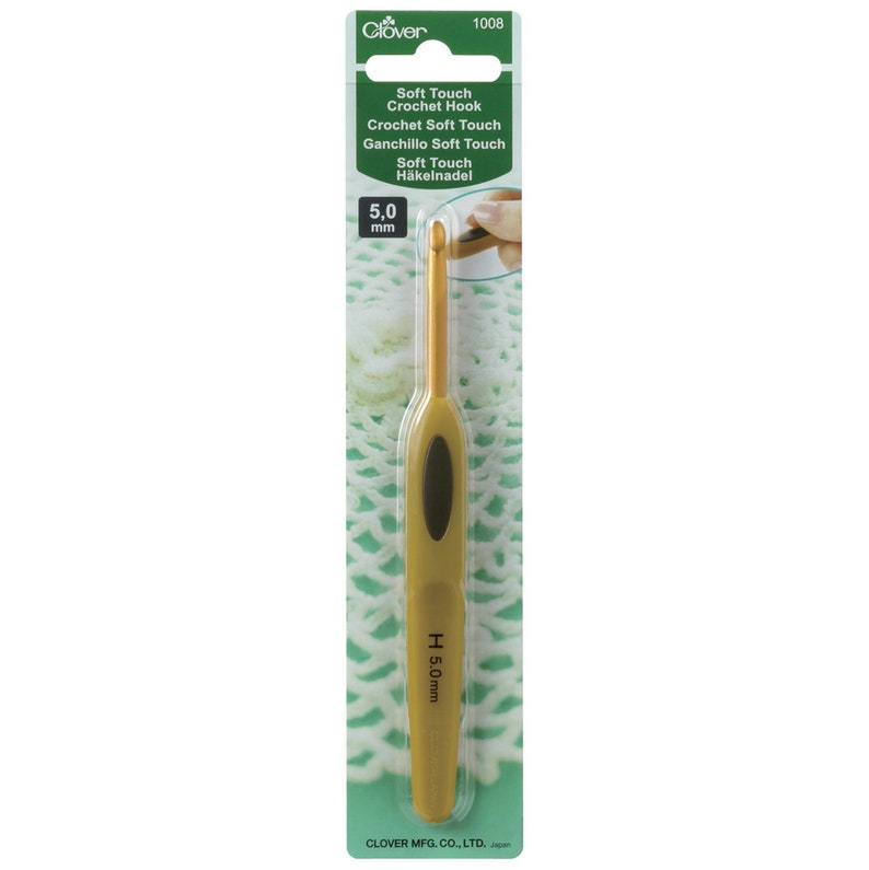 May include: Gold crochet hook with a soft touch grip. The hook is 5.0 mm and is packaged on a green and white card with the text "Soft Touch Crochet Hook" and "Clover 1008".
