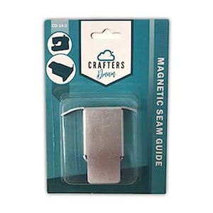 May include: A silver magnetic seam guide for sewing, packaged in a blue and white plastic package with the text "Crafters Dream" and "Magnetic Seam Guide".