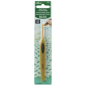 May include: A gold-coloured crochet hook with a black handle. The hook is labelled "Soft Touch Crochet Hook" and "2.0 mm".