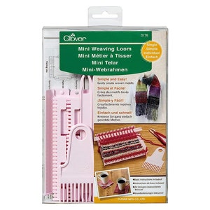 May include: A pink plastic mini weaving loom in a clear plastic box with instructions and a sample scarf. The box has the text "Mini Weaving Loom" and "Simple and Easy!" on it.