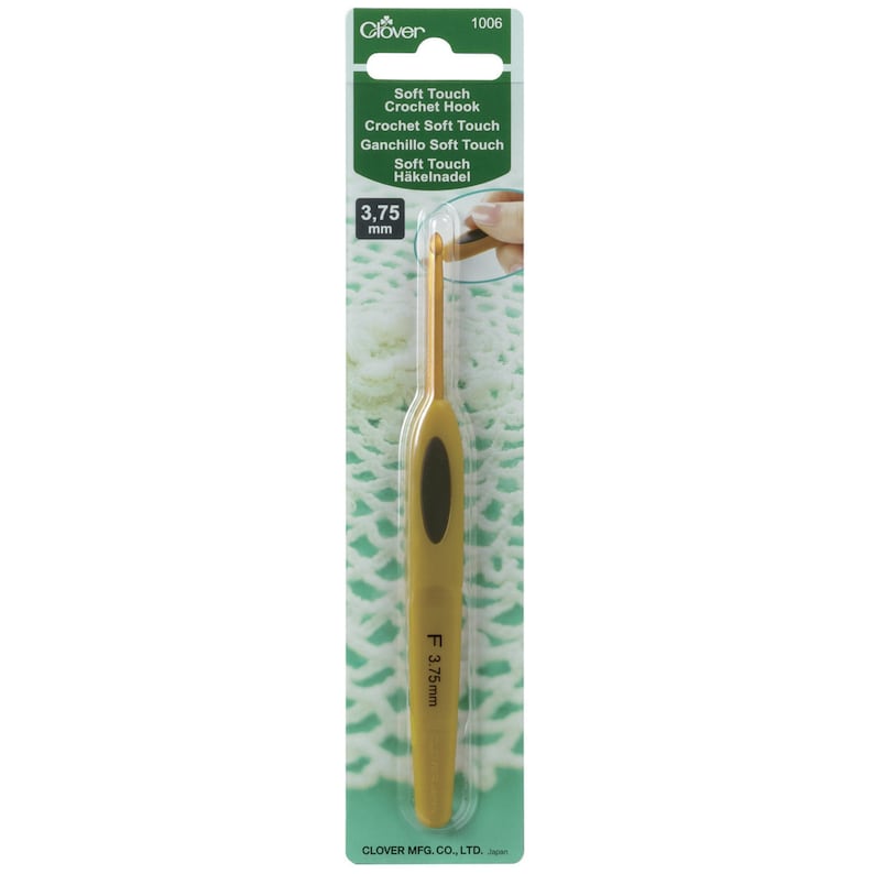 May include: Gold crochet hook with a soft touch grip. The hook is 3.75 mm and is packaged on a green and white card with the text "Soft Touch Crochet Hook" and "Clover 1006".