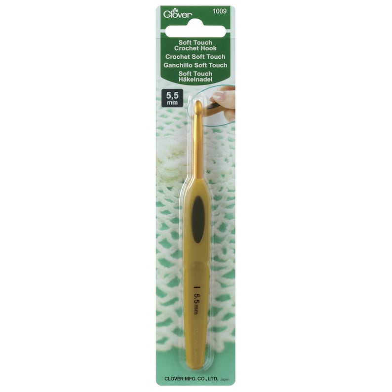 May include: A gold-coloured crochet hook with a soft-touch grip. The hook is 5.5 mm and is packaged on a green and white card with the text "Soft Touch Crochet Hook" and "Clover 1009".