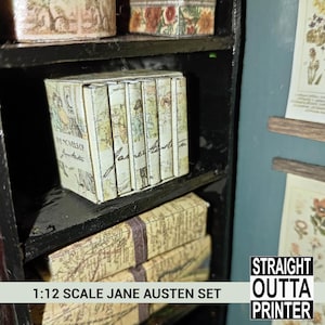 May include: A miniature 1:12 scale Jane Austen book set. The books have a vintage aesthetic with cream-colored covers and illustrations. The set includes several books and boxes, all arranged on a black shelf. The text "THE NOVELS OF Jane Austen" is visible.