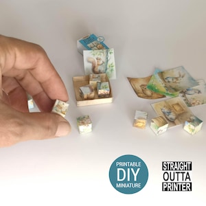 May include: Miniature printable DIY craft set featuring watercolor illustrations of woodland animals. Includes small cubes, cards, and a tiny wooden box. The image also includes the text "Printable DIY Miniature" and "Straight Outta Printer."